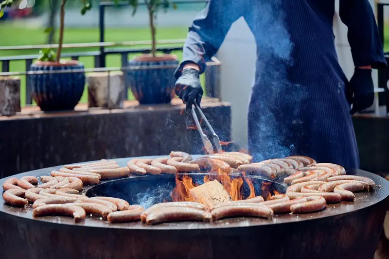 Sausages on the fire ring on the LOFT terrace